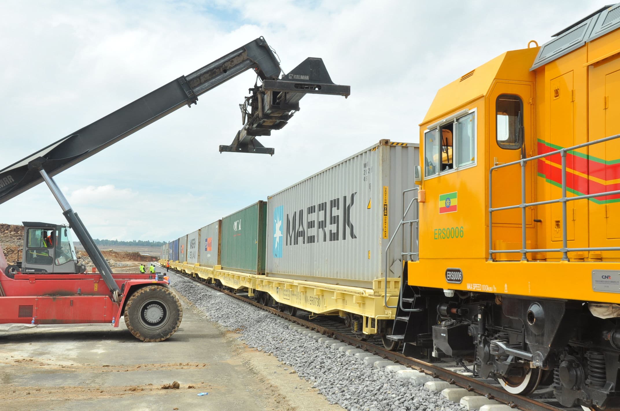 Ethiopian Railway locomotive loading containers under a gantry crane.
